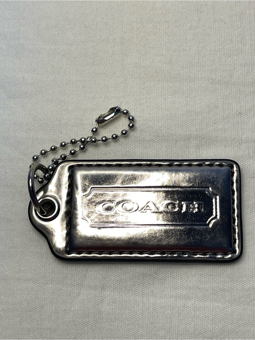Coach Silver Metallic Leather Hang Tag with Ball Chain - Picture 1 of 3